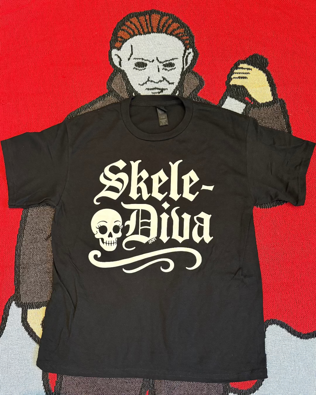 Black t-shirt with 'Skele-Diva' design on a red background